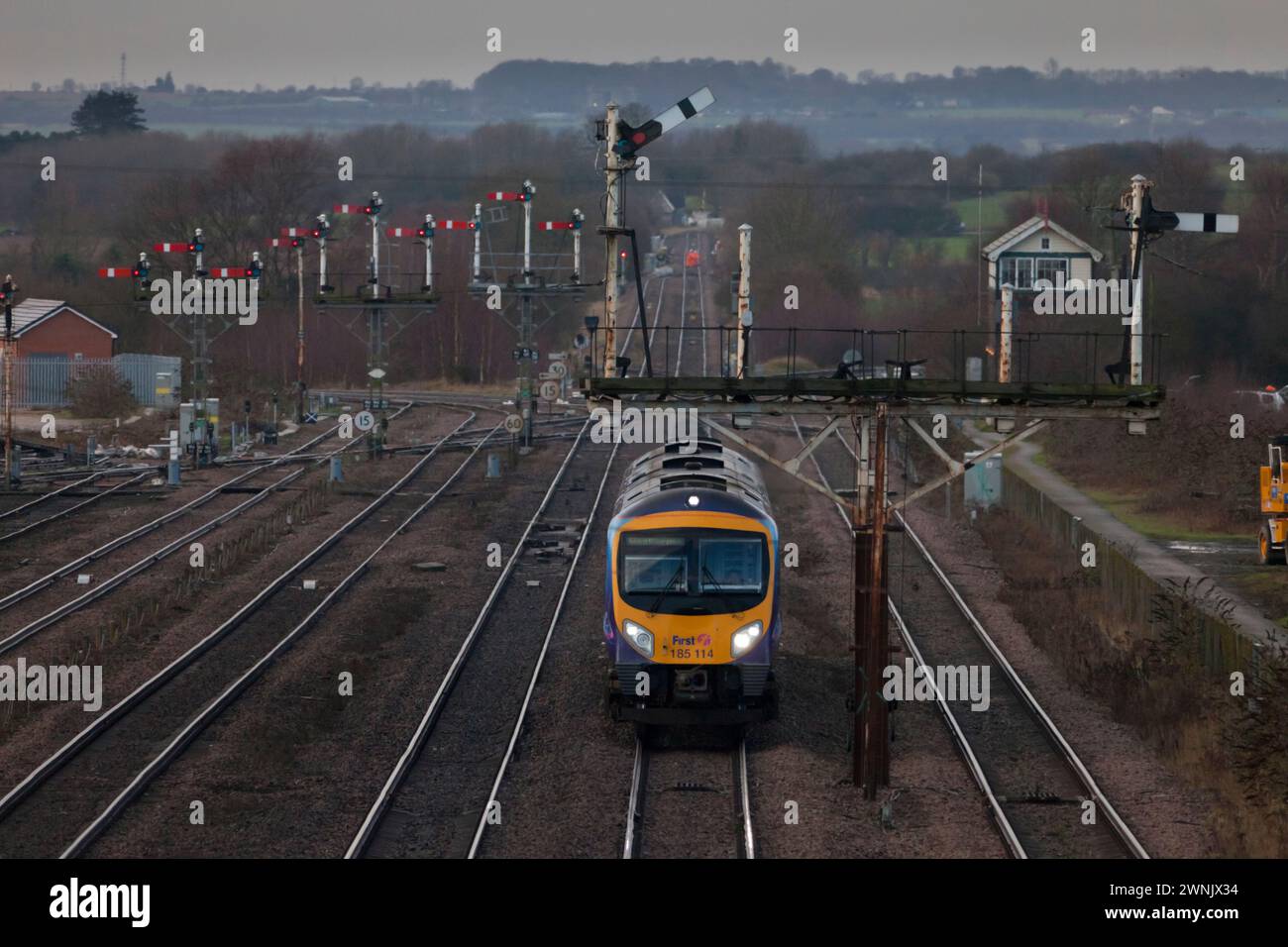 First Transpennine Express Siemens class 185 diesel train 185114 passing the large semaphore bracket signal at Wrawby Junction Barnetby, Lincs, UK Stock Photo