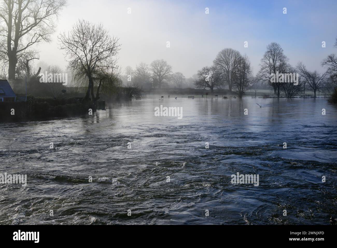 Avon Valley, Fordingbridge, Hampshire, UK, 3rd March 2024: Weather. Early meteorological spring morning frost and mist. The River Avon water level remains very high after recent rain. Credit: Paul Biggins/Alamy Live News Stock Photo