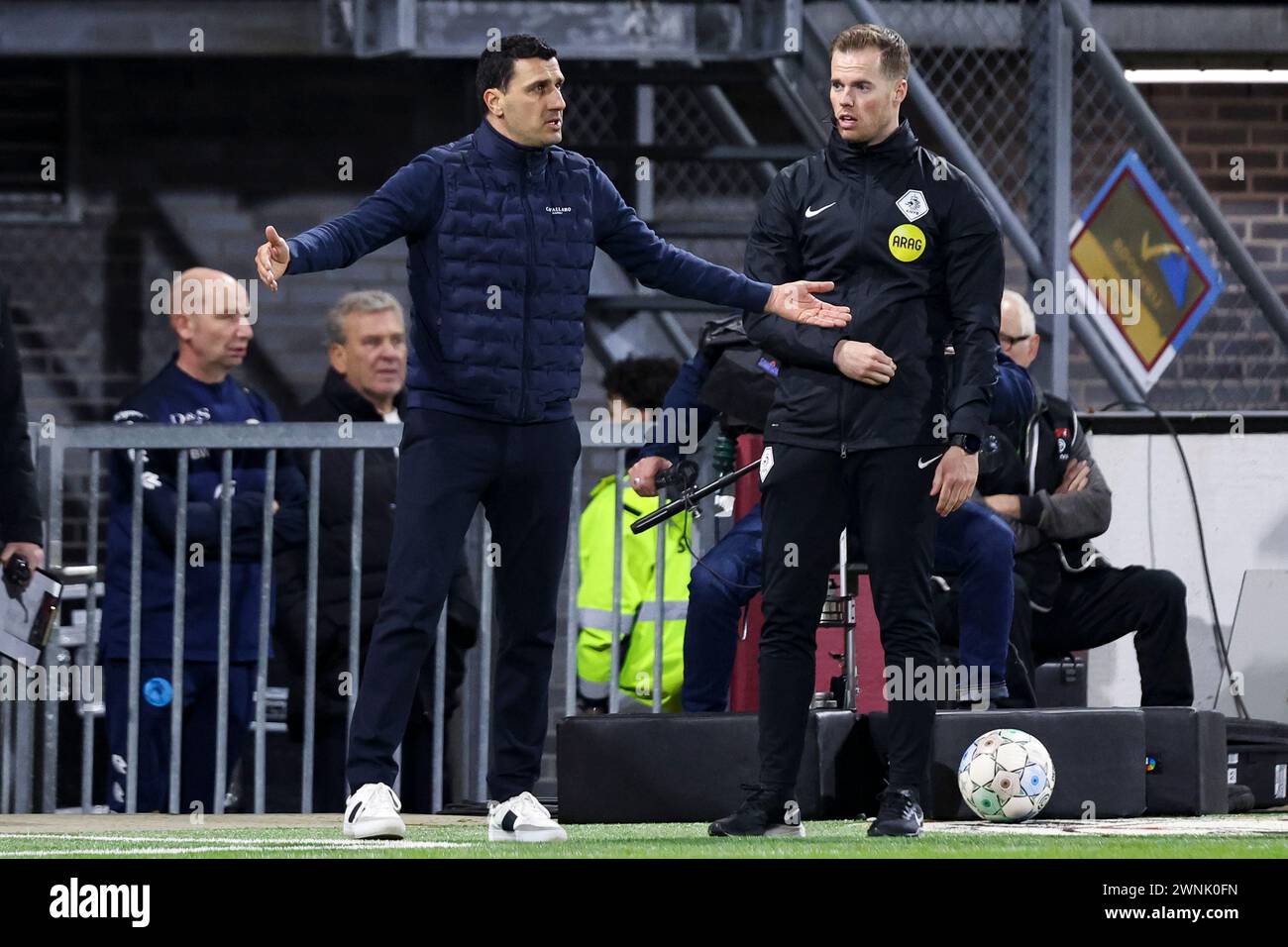 ROTTERDAM, NETHERLANDS - MARCH 2: Headcoach Maarten Martens (AZ Alkmaar), fourth official Jannick van der Laan Speaks with during the Eredivisie match Stock Photo
