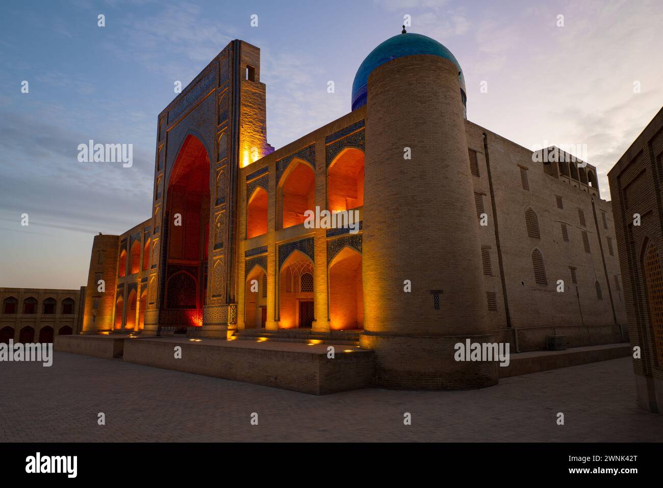 BUKHARA, UZBEKISTAN - SEPTEMBER 11, 2022: Medieval Mir-i-Arab madrasa  in night illumination on the early morning Stock Photo