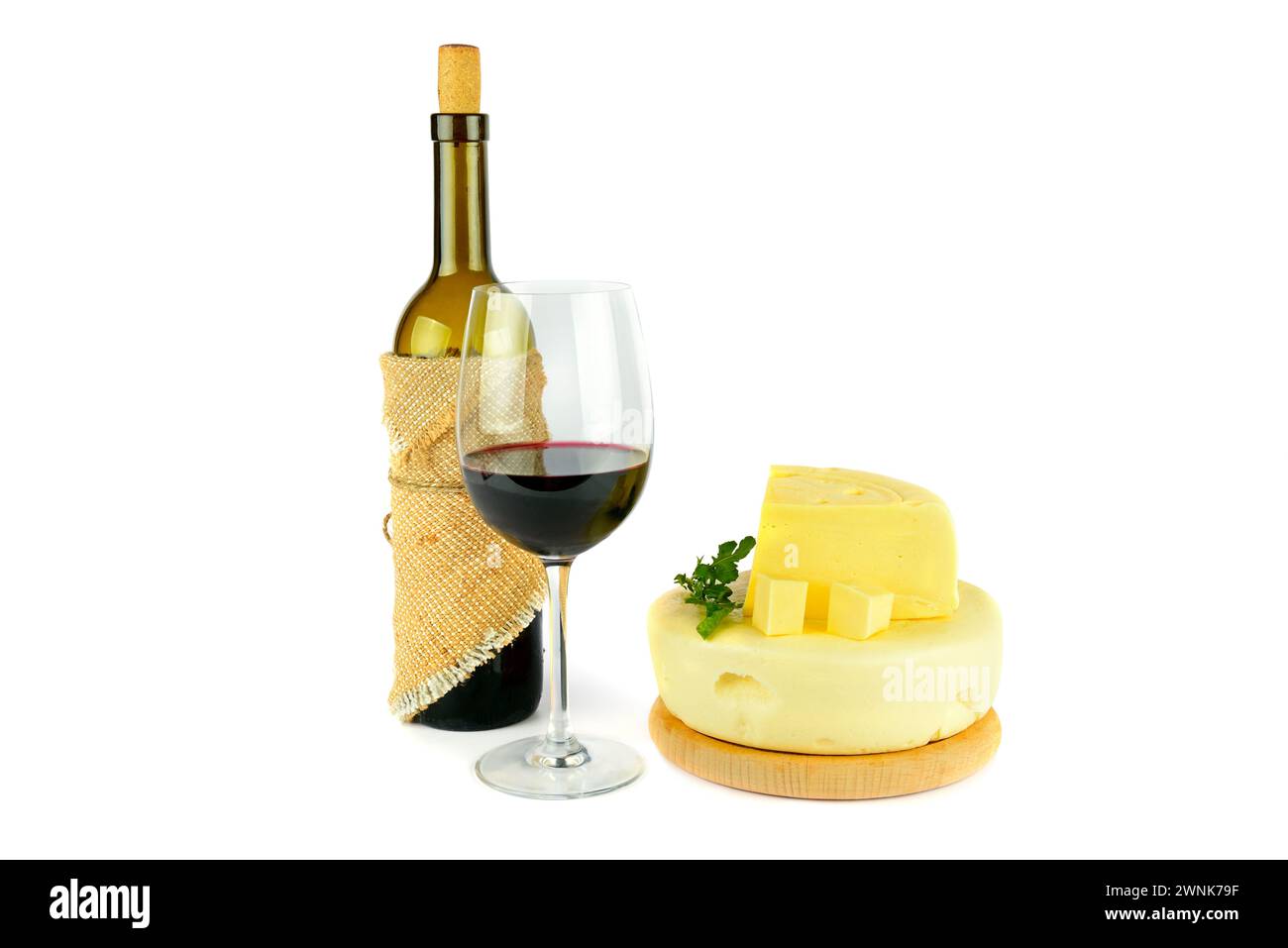 Bottle with glass of red wine and cheese isolated on white background. Stock Photo