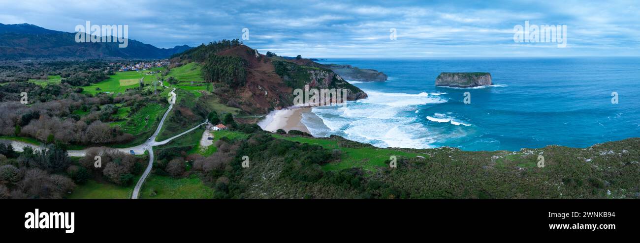 Coastal landscape on the beach of Andrín or Ballota and the Castro Ballota island in the surroundings of the town of Andrín. Cantabrian Sea. Council o Stock Photo