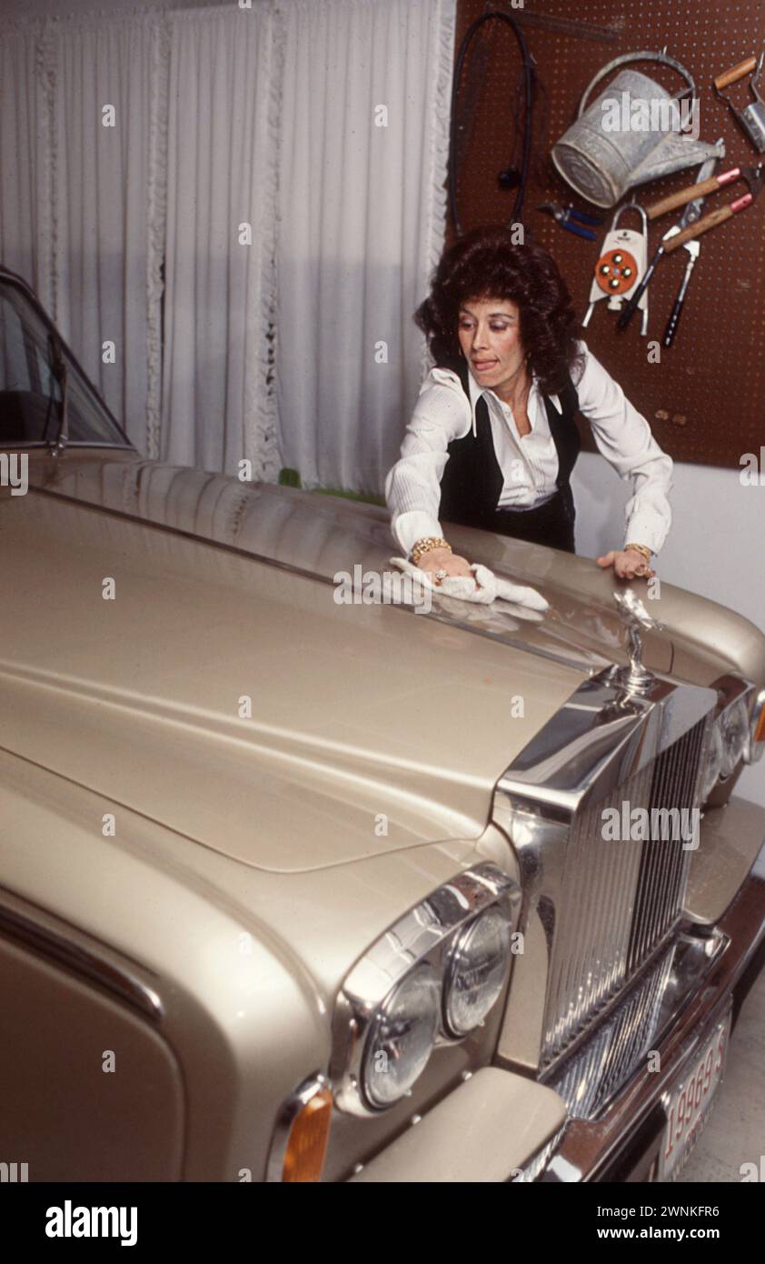Pete Rose's first wife Karolyn Englehardt cleans the hood of the family