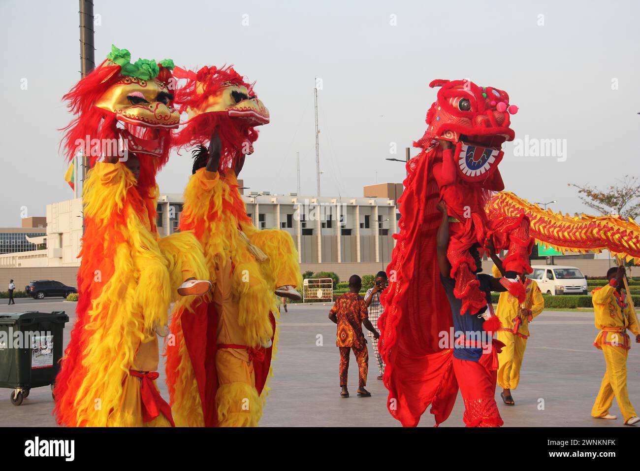 Cotonou, Benin. 2nd Mar, 2024. Artists perform a lion dance at a Chinese New Year Fair in Cotonou, Benin, March 2, 2024. A Chinese New Year Fair, showcasing the diversity and richness of Chinese culture to the public in Benin, was launched on Saturday evening in the Esplanade des Amazones Square in Cotonou, Benin's economic capital. Credit: Seraphin Zounyekpe/Xinhua/Alamy Live News Stock Photo