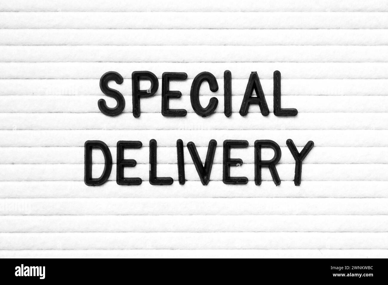 Black color letter in word special delivery on white felt board ...