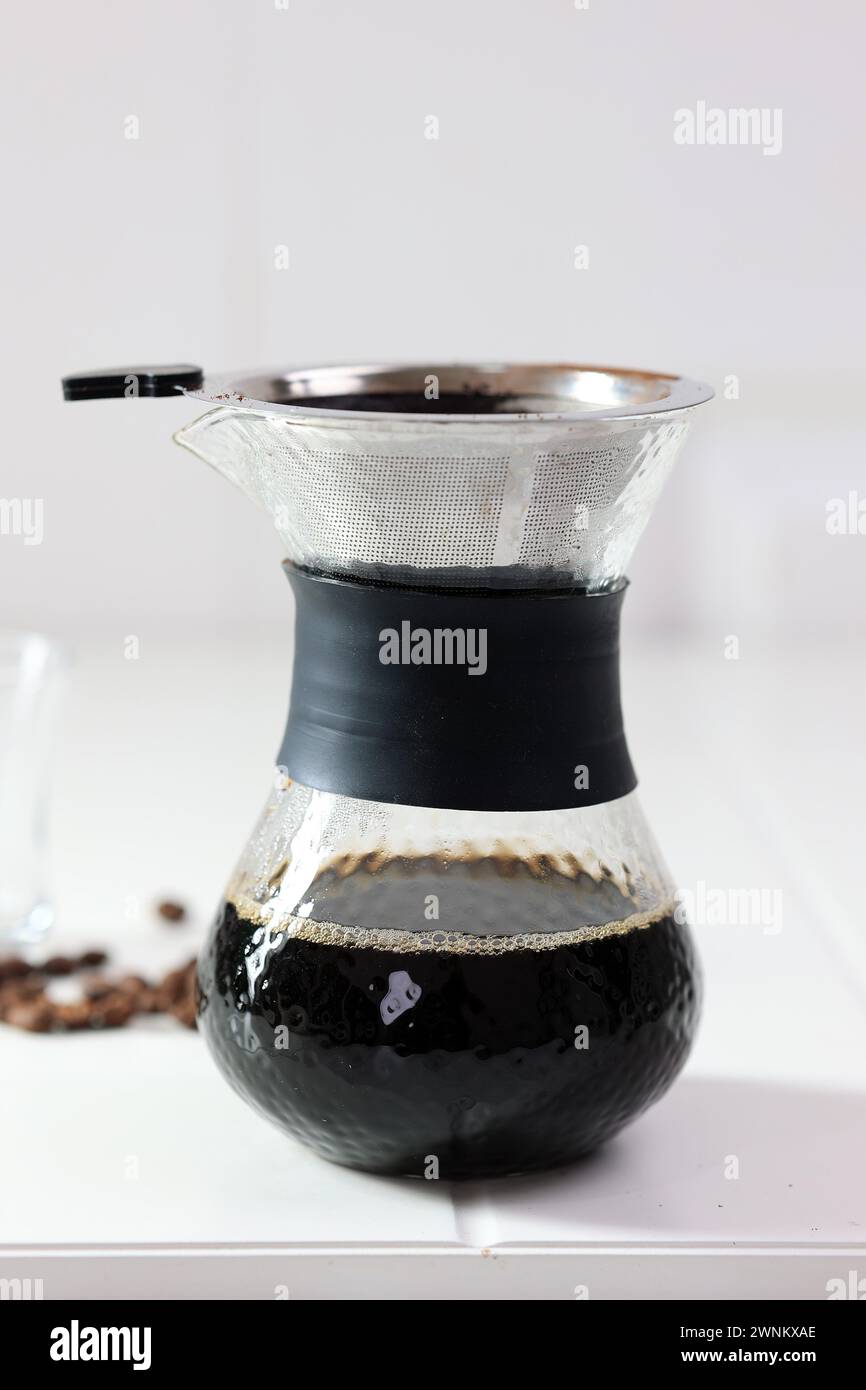 V60 Pour Over Manual Coffee Maker on White Table Stock Photo