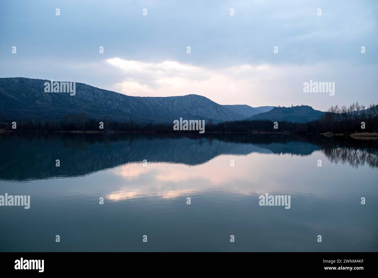 Evening atmosphere at Tribalj Lake, Vinodol municipality, Kvarner Gulf region, Kvarner Bay, Croatia, Europe. On the right behind the hill with Stock Photo