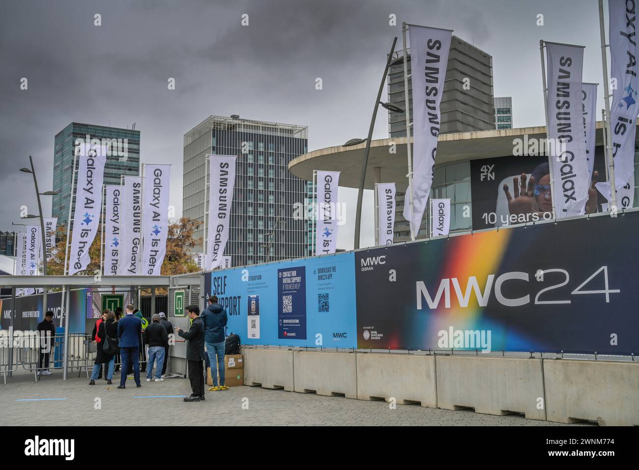 Visitors outside the exhibition centre, MWC Mobile World Congress 2024, Barcelona, Spain Stock Photo