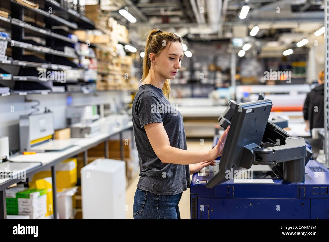 Woman working in a printing factory Stock Photo
