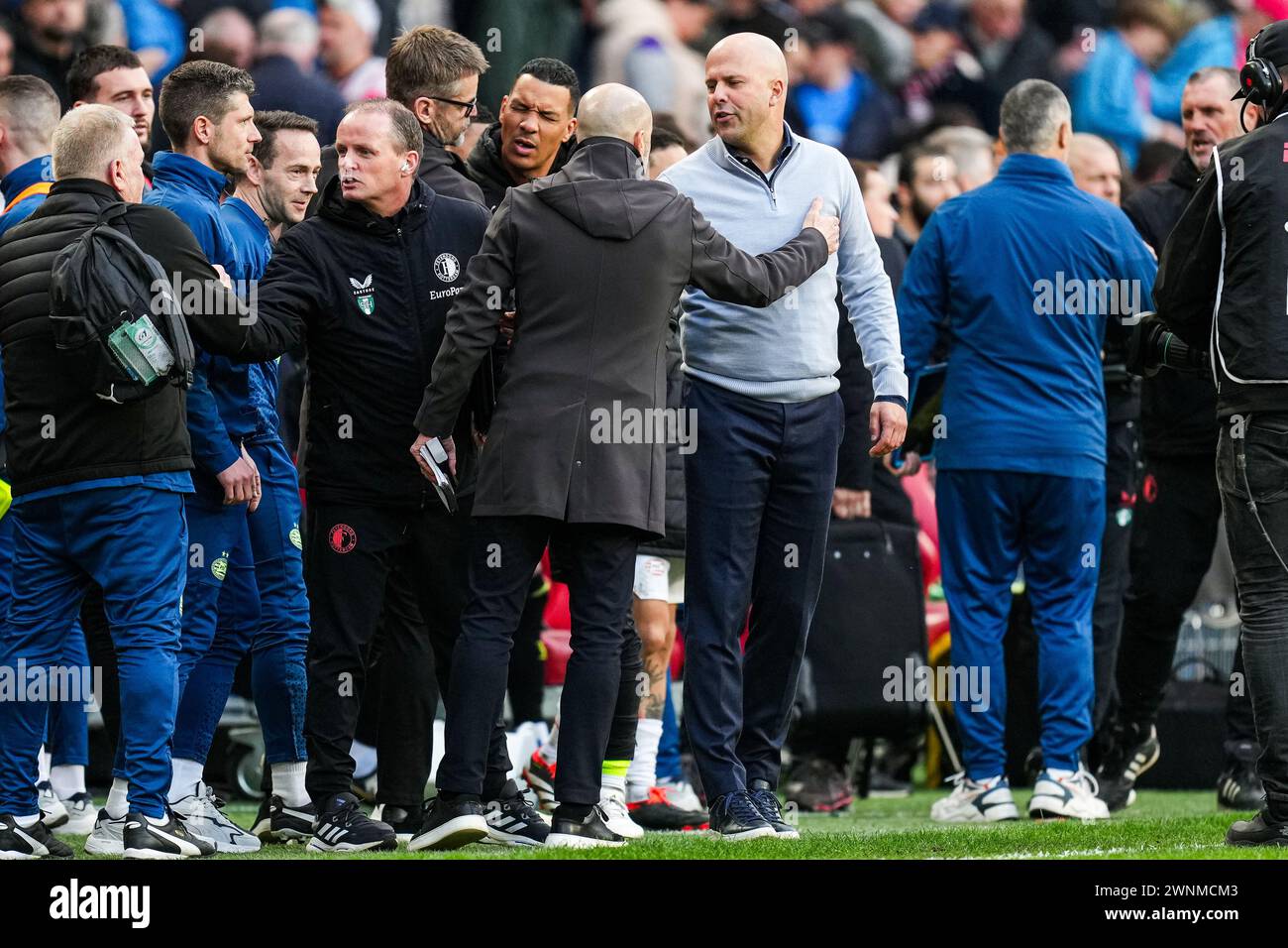 Eindhoven, The Netherlands. 03rd Mar, 2024. Eindhoven - PSV Eindhoven coach Peter Bosz, Feyenoord coach Arne Slot during the Eredivisie match between PSV v Feyenoord at Philips Stadion on 3 March 2024 in Eindhoven, The Netherlands. Credit: box to box pictures/Alamy Live News Stock Photo