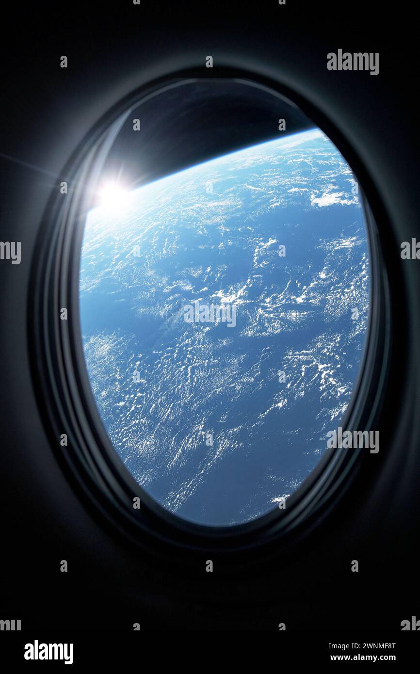View of planet Earth from a space station porthole. Elements of this image furnished by NASA. Stock Photo