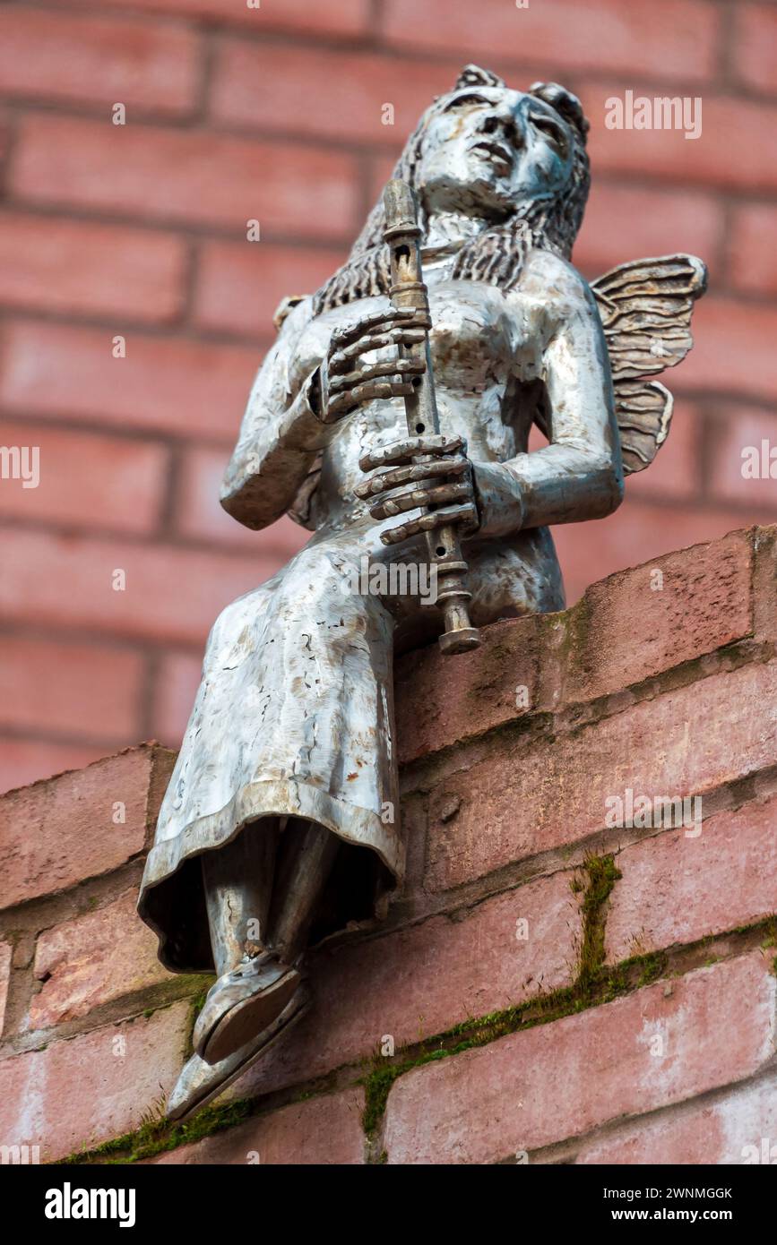 The statue of an owl on the trail of statues in Prescot, home of the Shakespeare North theatre. Part of the witches chant from Shakespeare's Macbeth. Stock Photo