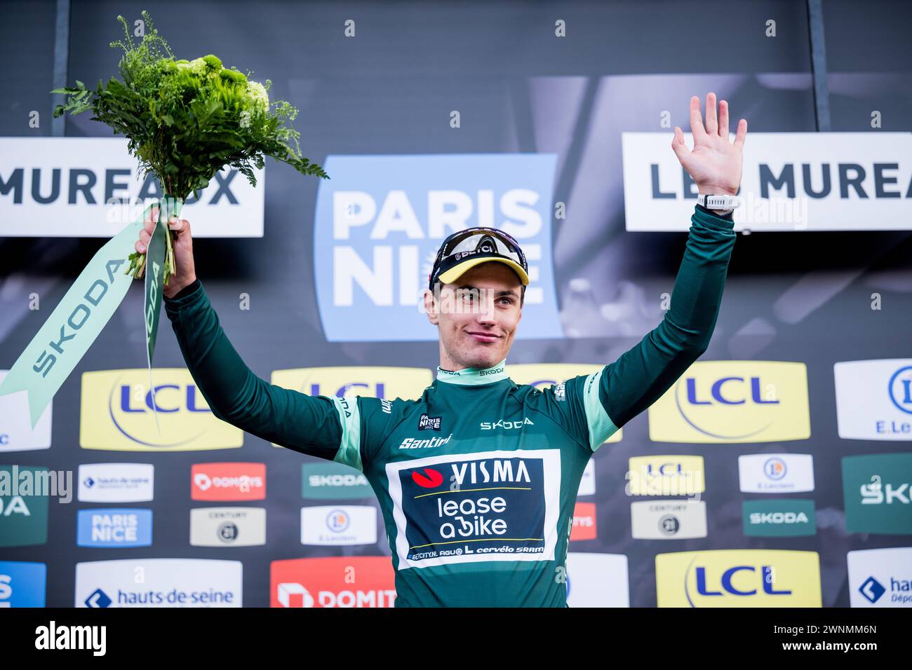 Dutch Olav Kooij of Team VismaLease a Bike celebrates on the podium in