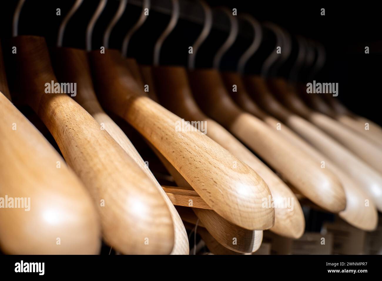 Wooden hangers for sale on a rack Stock Photo Alamy