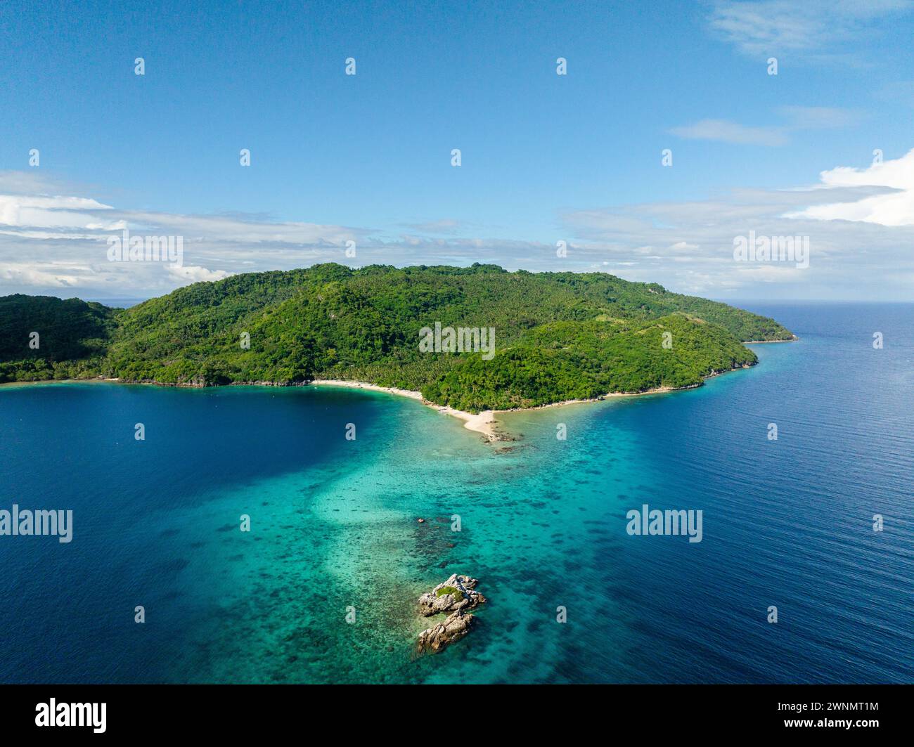 Top view of Blue sea and Alad Island with small white beach. Romblon ...