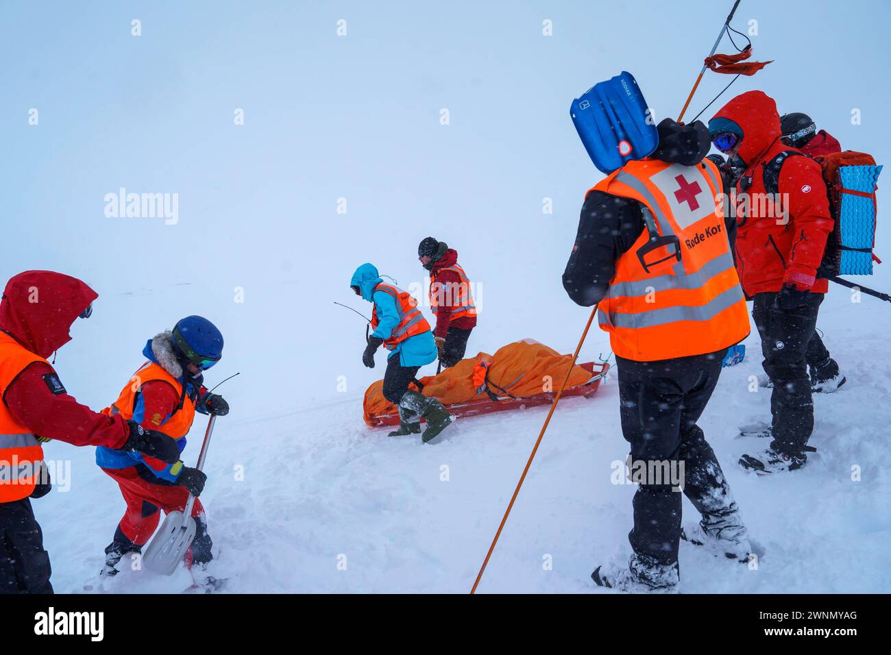 Finse 20240301.A person is transported on a sled after being found buried in an avalanche during an exercise where the Red Cross, Norwegian rescue dogs and the police practice under realistic conditions in the high mountains. The exercise is part of the Finsekurset, which is the Red Cross's course for the training of team leaders who must lead search operations regardless of the season and surroundings. Photo: Cornelius Poppe / NTB Stock Photo