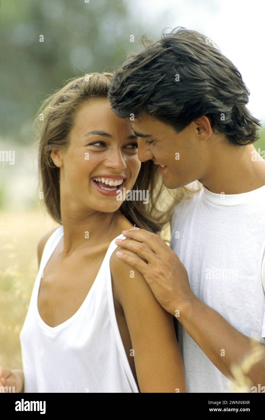 young naturiste naturist young couple lay down on the beach blod hair young woman topless  Stock Photo - Alamy