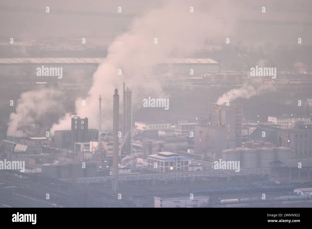 Lovosice, CzechiaFeb 16, 2024 Chemical plant factory smoke stacks
