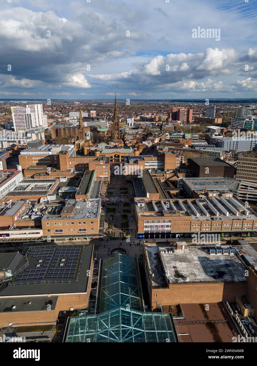 Aerial view of a bustling city with dramatic clouds overhead Stock ...