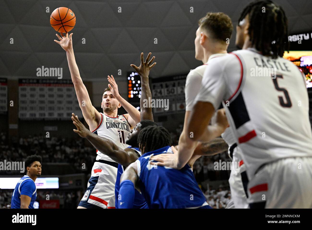 UConn forward Alex Karaban (11) shoots in the second half of an NCAA