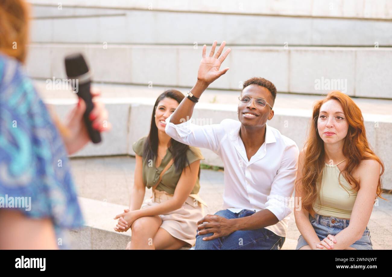 Excited multiethnic friends showing hi-res stock photography and images ...