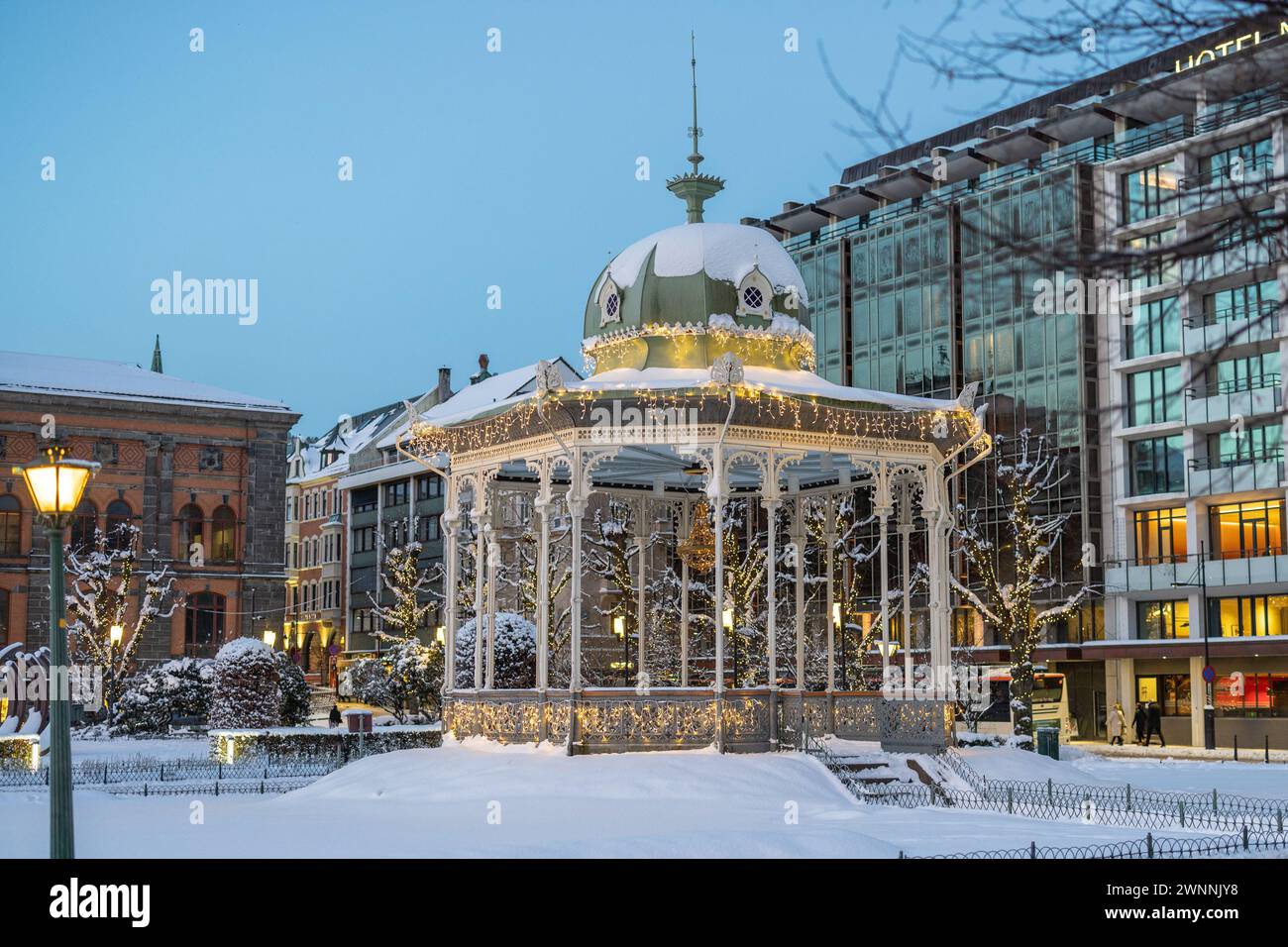 Musical pavilion in Bergen, close to the lake in early morning hours in winter. Snow capped pavillion in the city centre, with ornaments such as chris Stock Photo