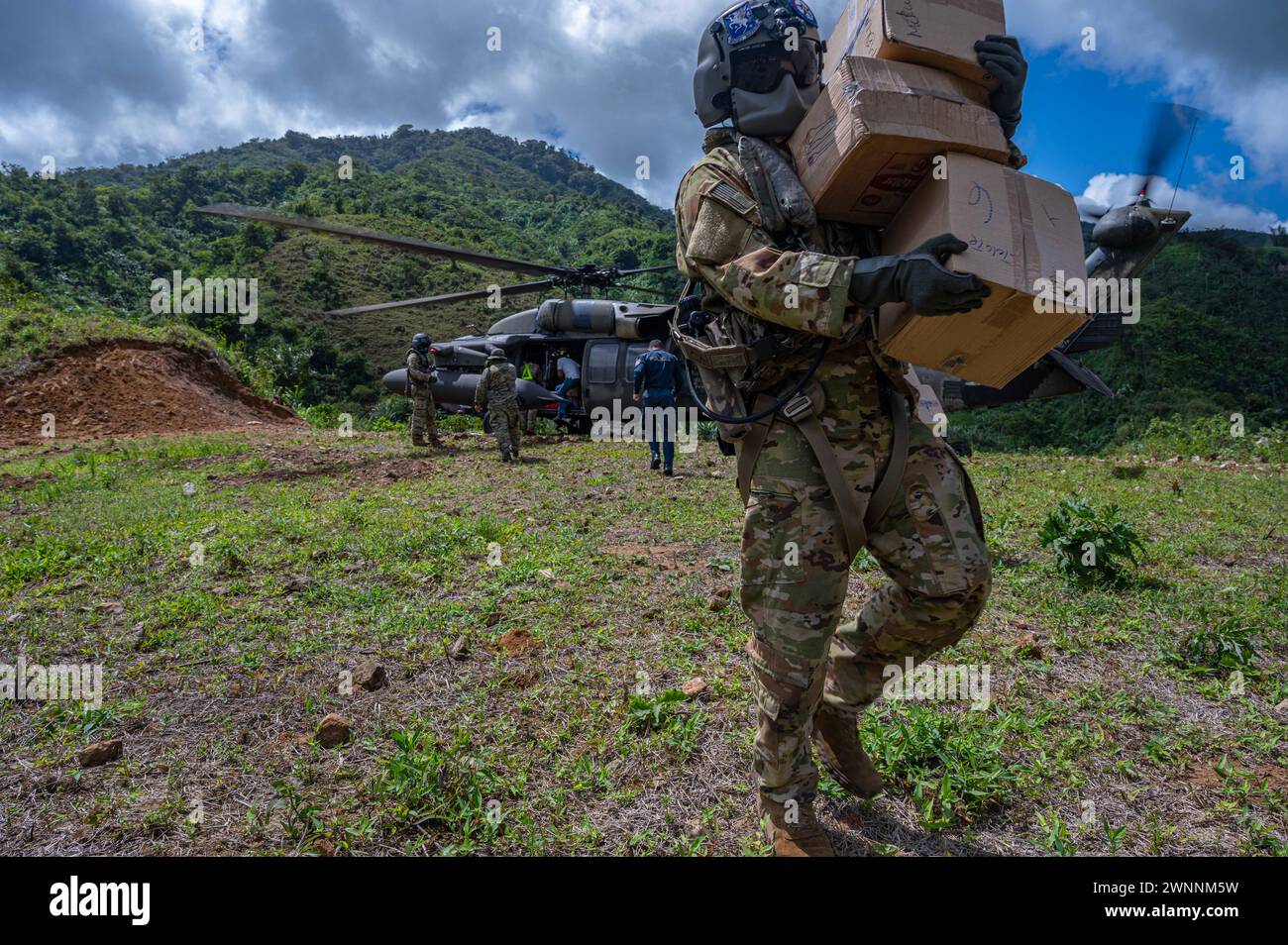Mina Zorra, Panama. 29 February, 2024. U.S. Army soldiers unload food and structural materials from a UH-60 Blackhawk helicopter during Exercise PANAMAX, February 29, 2024 near Mina Zorra, Panama, Feb. 29, 2024. During the exercise the 1-228th Aviation Regiment transported over 500 thousand pounds of equipment including food and supplies as well as medical team to care for local residents.  Credit: TSgt. Nick Erwin/US Army/Alamy Live News Stock Photo