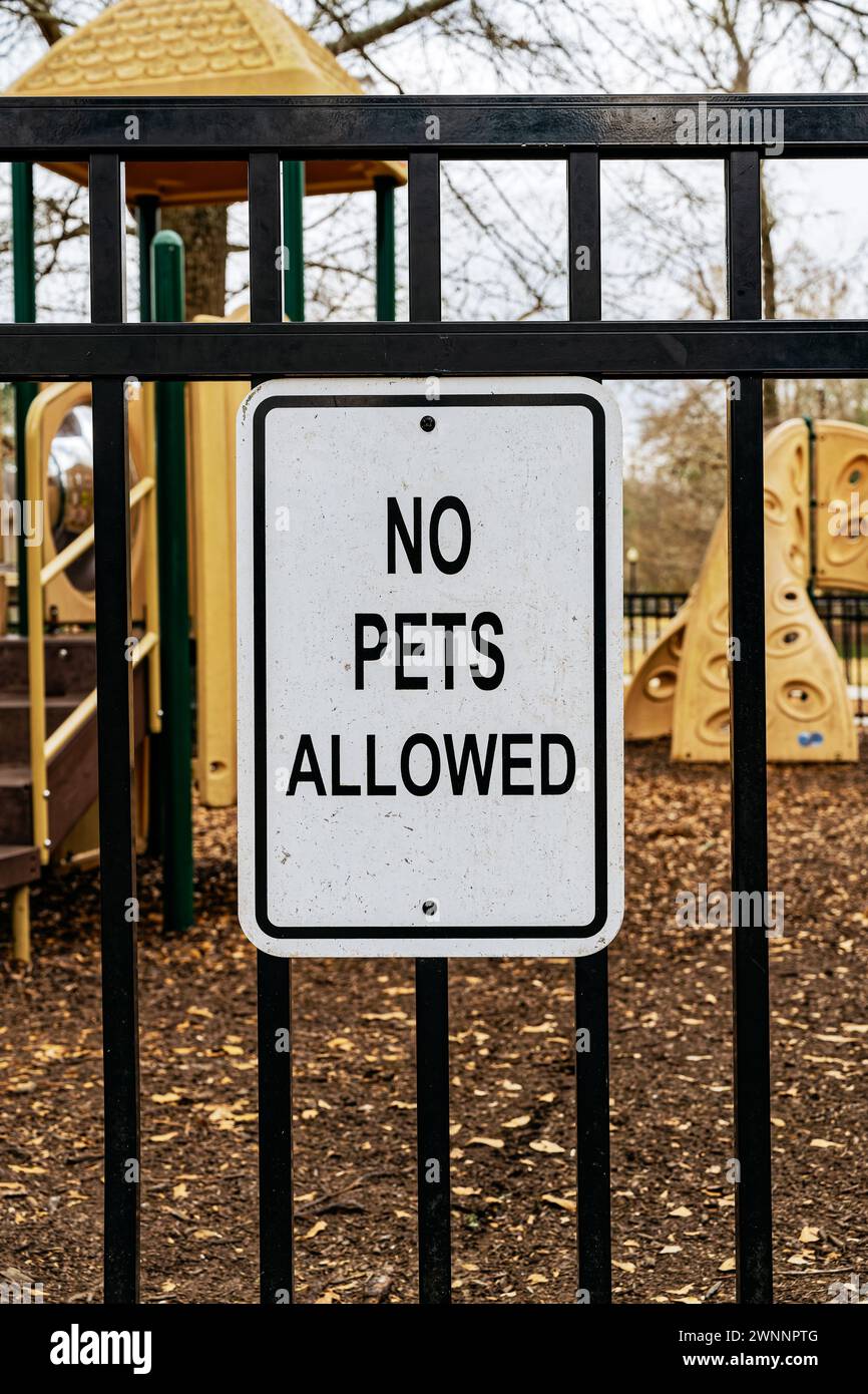 No pets allowed sign at the entrance to a children's playground in a residential neighborhood in Pike Road Alabama, USA. Stock Photo