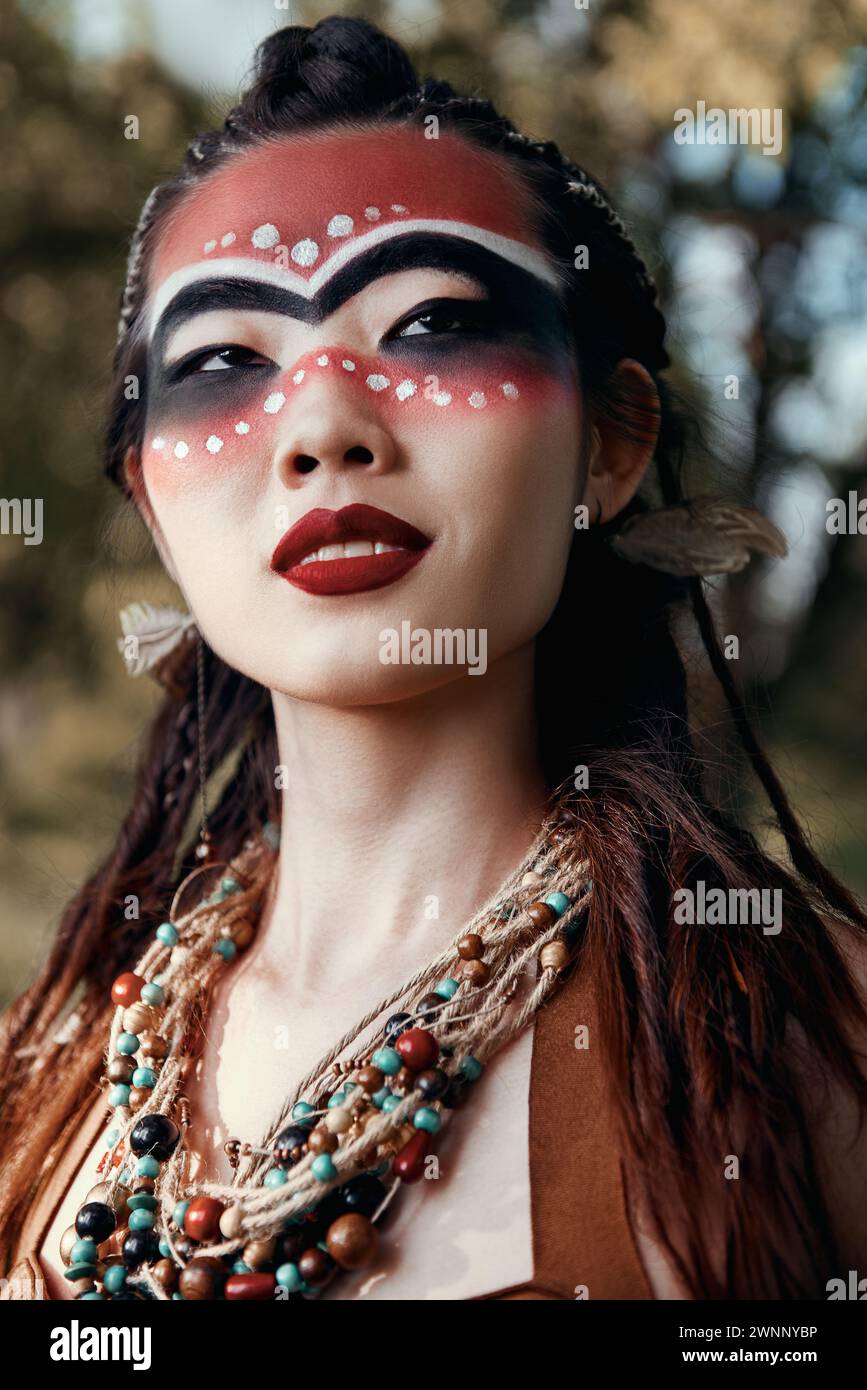 Outdoor close-up portrait of the cute young shamaness (witch doctor) Stock Photo