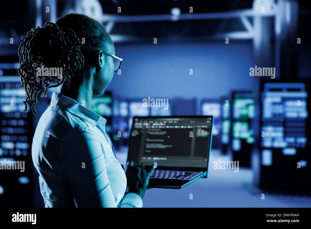 Licensed programmer running code and programming on laptop ...