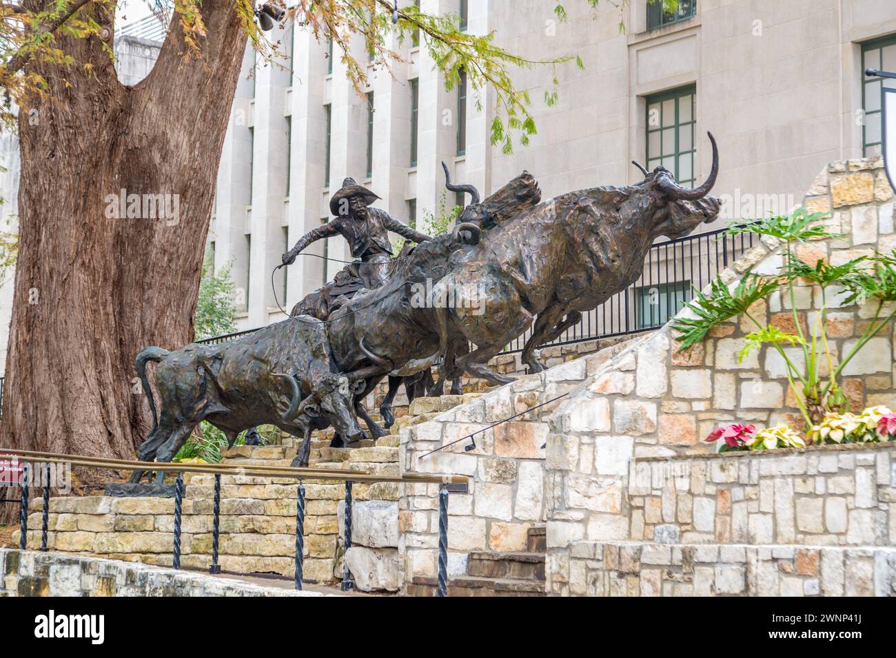 'Coming Home to the Briscoe' sculpture by artist T.D. Kelsey at the Briscoe Western Art Museum on the River Walk in downtown San Antonio, Texas Stock Photo