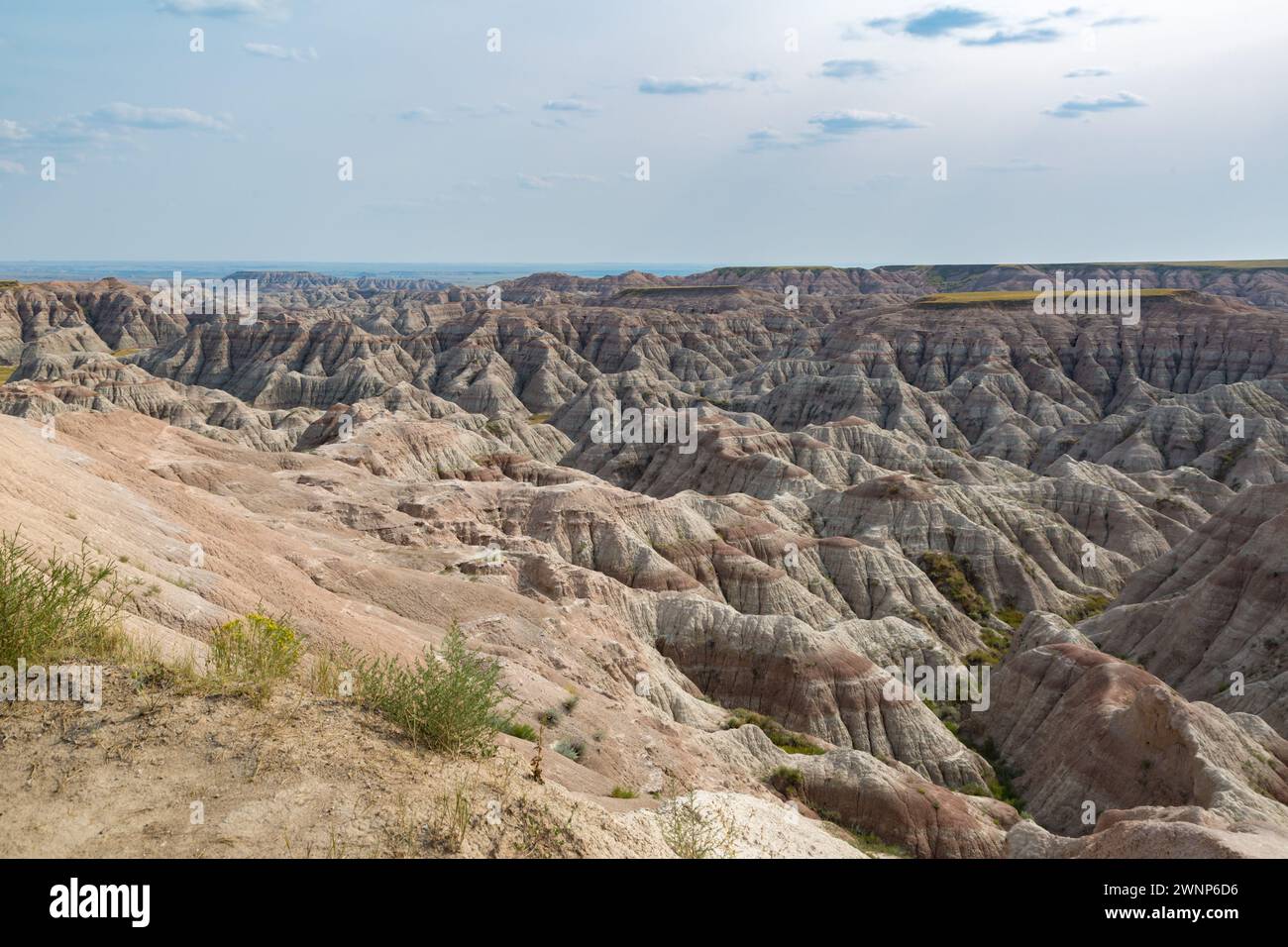 Erosion exposes colorful layers of sedimentary rock in the Badlands ...