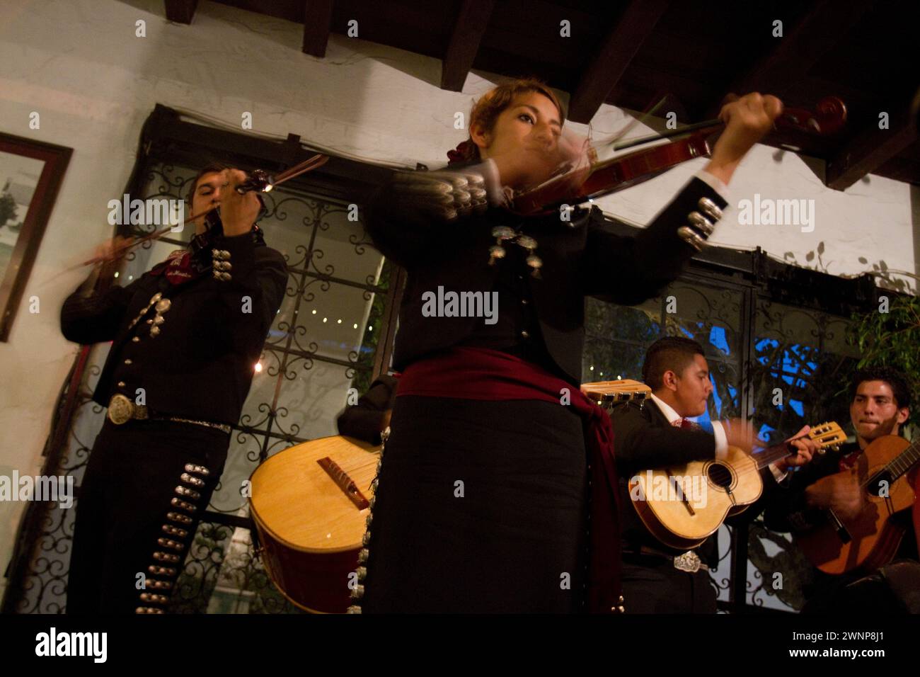 Mariachis sing and play at El Paseo Mexican Restaurant, a popular restaurant in Santa Barbara, California. Stock Photo