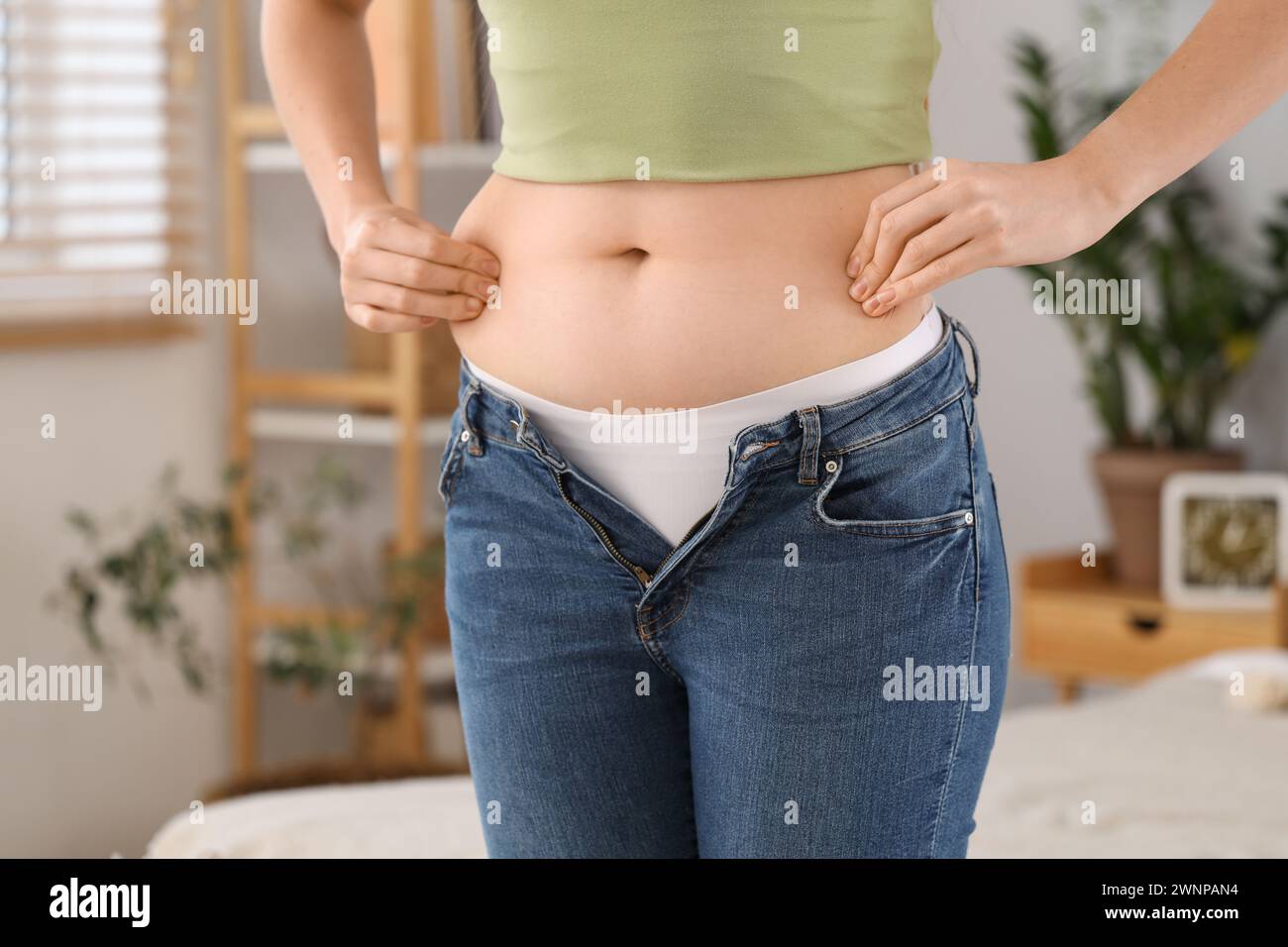 Woman wearing tight jeans hi-res stock photography and images - Alamy