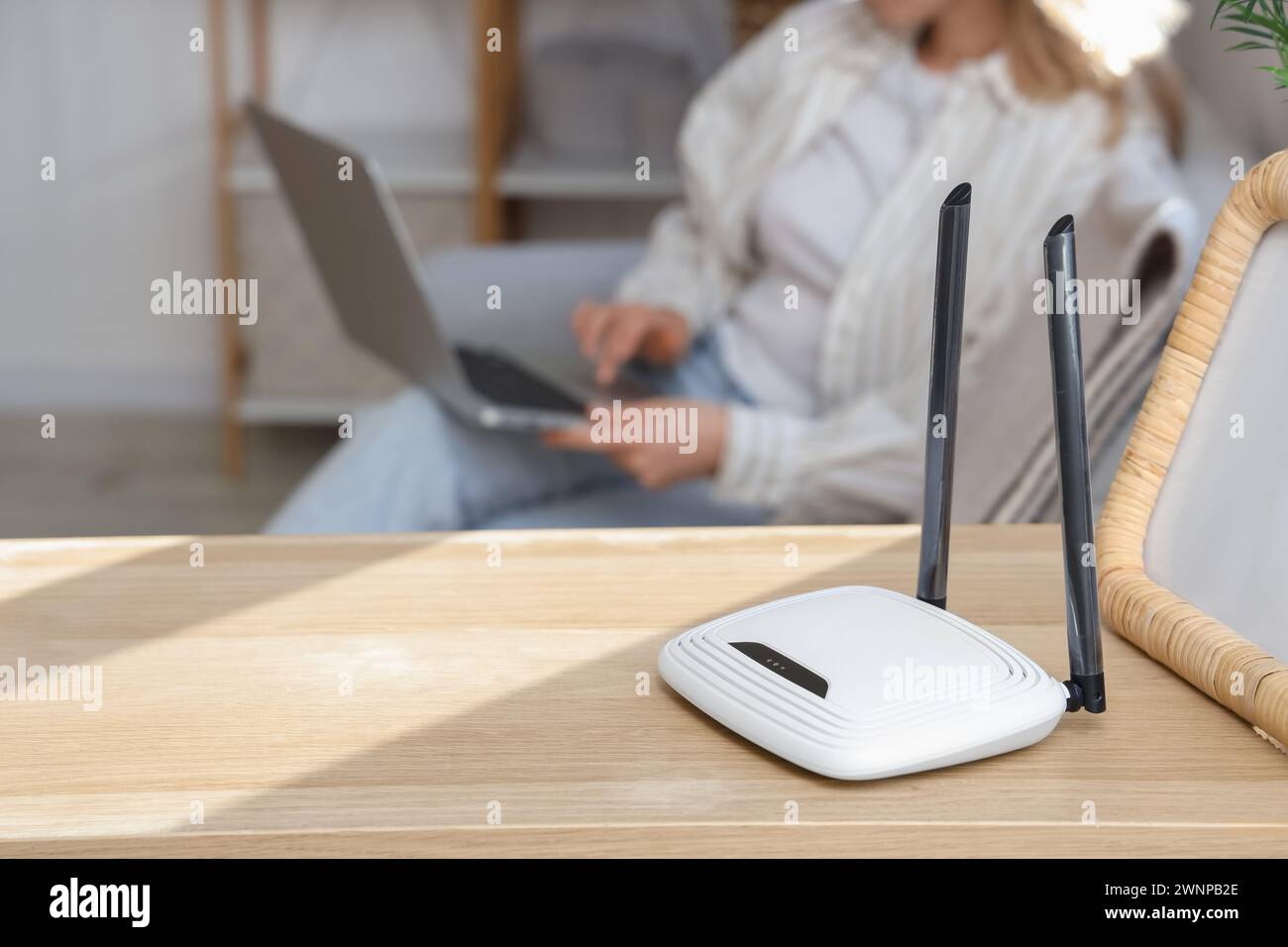 Modern wi-fi router on shelf in room, closeup Stock Photo - Alamy