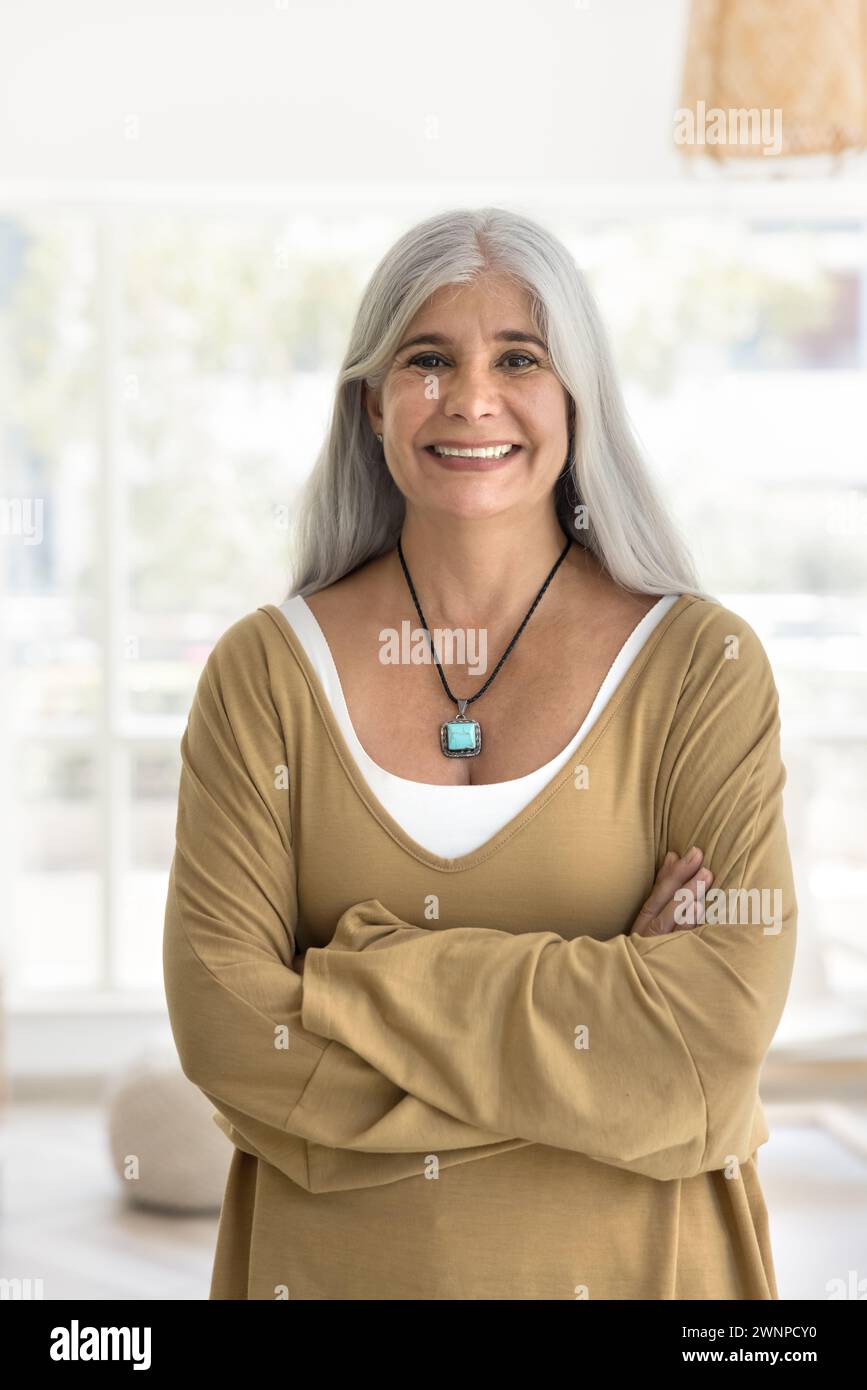 Happy confident senior woman with grey hair standing at Stock Photo - Alamy
