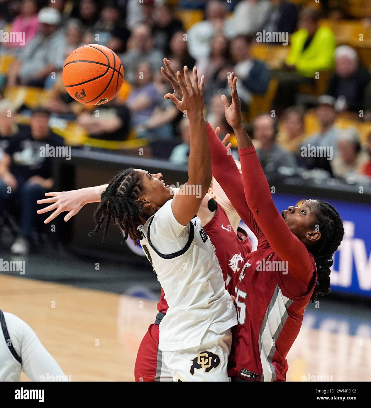 Washington State center Bella Murekatete (55) blocks a shot by Colorado