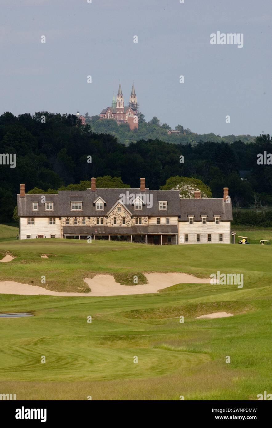 View of the Erin Hills Golf Course clubhouse from the 18th hole with Holy Hill Catholic Monastery looming in the background. Please send licensing req Stock Photo