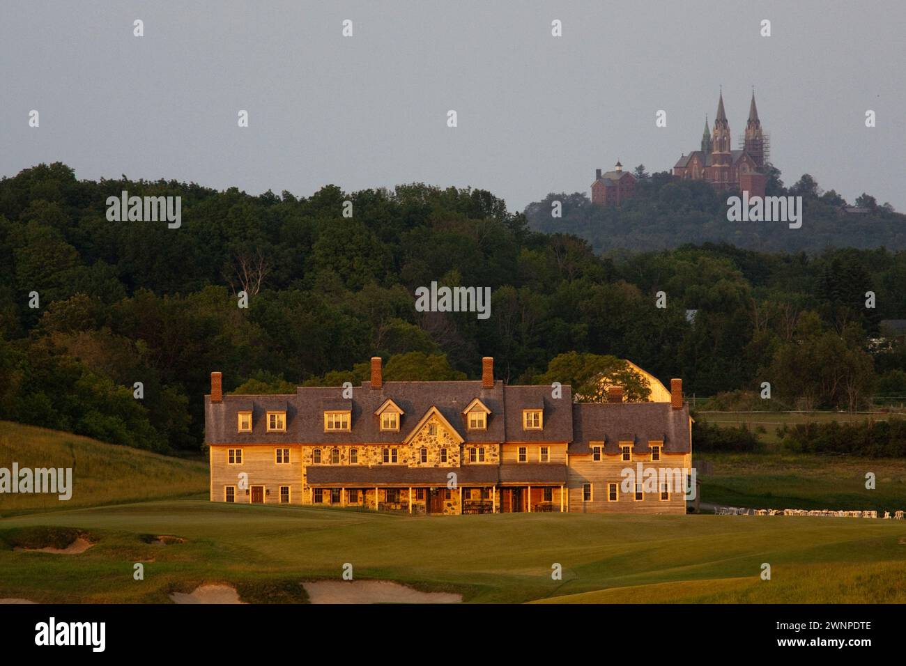 View of the Erin Hills Golf Course clubhouse from the 18th hole with Holy Hill Catholic Monastery looming in the background. Please send licensing req Stock Photo