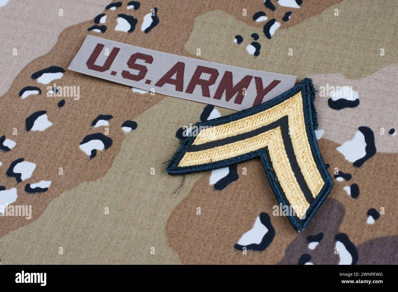 US ARMY branch tape and corporal rank patch on desert camouflage ...