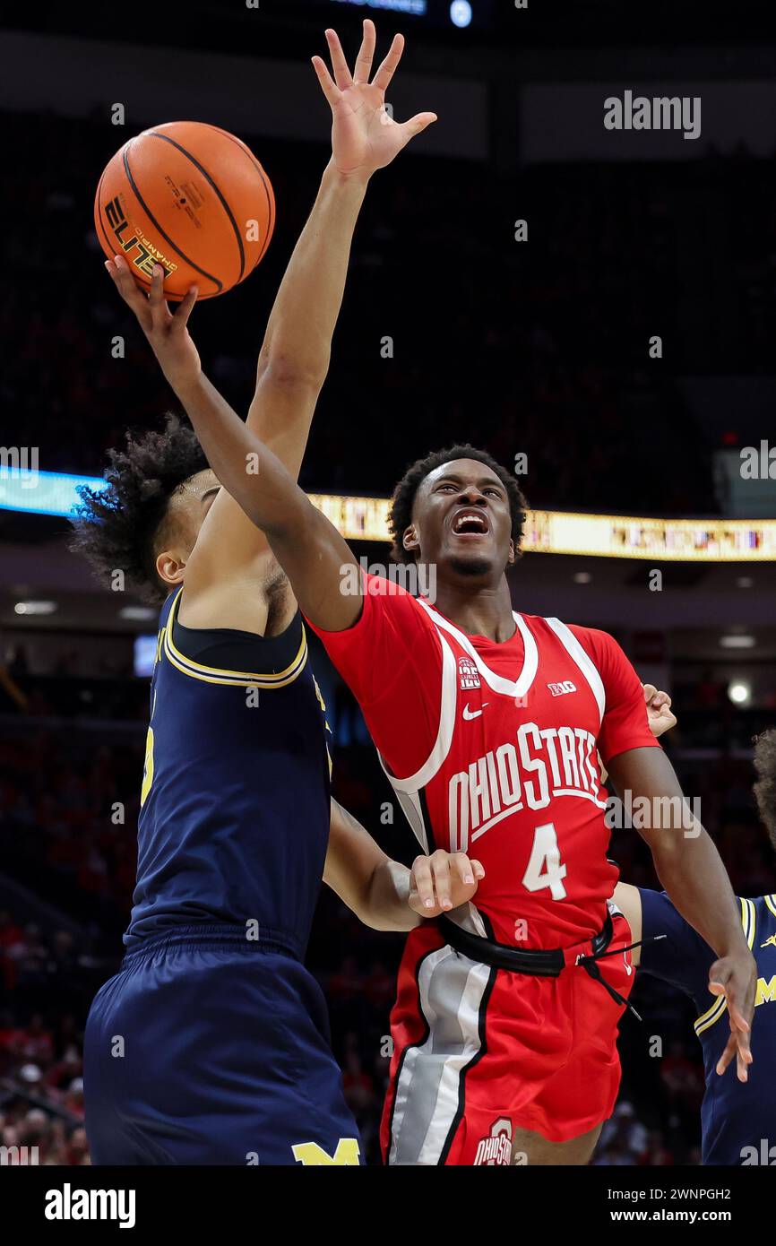 Columbus, Ohio, USA. 3rd Mar, 2024. Ohio State Buckeyes guard Dale Bonner (4) lays up a shot around Michigan Wolverines guard Dug McDaniel (0) during the game between the Michigan Wolverines and the Ohio State Buckeyes at Value City Arena, Columbus, Ohio. (Credit Image: © Scott Stuart/ZUMA Press Wire) EDITORIAL USAGE ONLY! Not for Commercial USAGE! Stock Photo