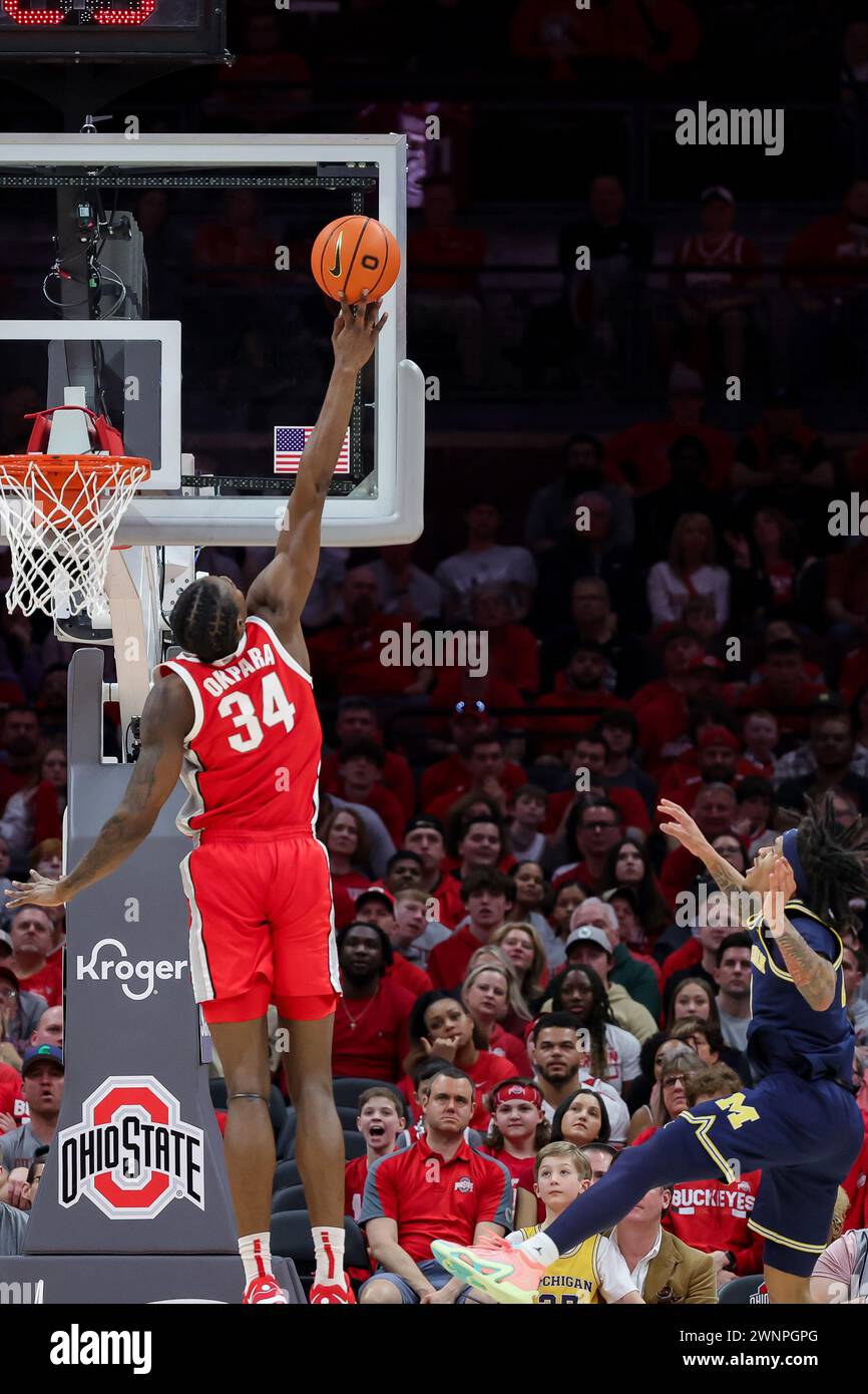 Columbus, Ohio, USA. 3rd Mar, 2024. Ohio State Buckeyes center Felix Okpara (34) goes up high to block a shot by Michigan Wolverines guard Dug McDaniel (0) during the game between the Michigan Wolverines and the Ohio State Buckeyes at Value City Arena, Columbus, Ohio. (Credit Image: © Scott Stuart/ZUMA Press Wire) EDITORIAL USAGE ONLY! Not for Commercial USAGE! Stock Photo