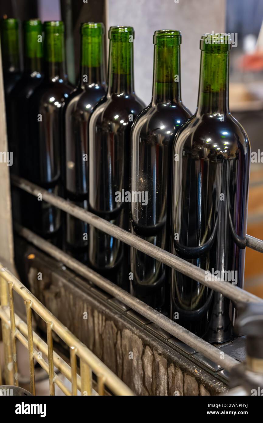 Wine making line, bottling and corking line in underground cellar, Saint-Emilion wine making region picking, cru class Merlot or Cabernet Sauvignon re Stock Photo