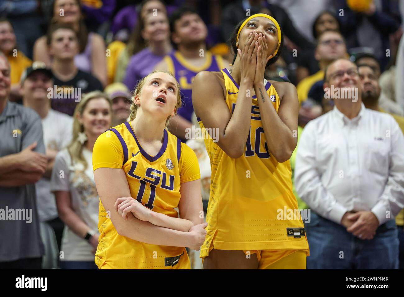Baton Rouge, LA, USA. 03rd Mar, 2024. LSU seniors Hailey Van Lith (11) and Angel Reese (10) look up at the video board for a senior tribute video after NCAA Women's Basketball game action between the Kentucky Wildcats and the LSU Tigers at the Pete Maravich Assembly Center in Baton Rouge, LA. Jonathan Mailhes/CSM (Credit Image: © Jonathan Mailhes/Cal Sport Media). Credit: csm/Alamy Live News Stock Photo