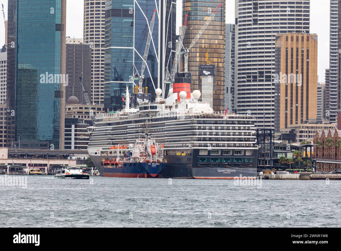 Queen Victoria cruise ship in Circular Quay, Sydney, supported by ICS Reliance fuel tanker, Sydney,NSW,Australia Stock Photo