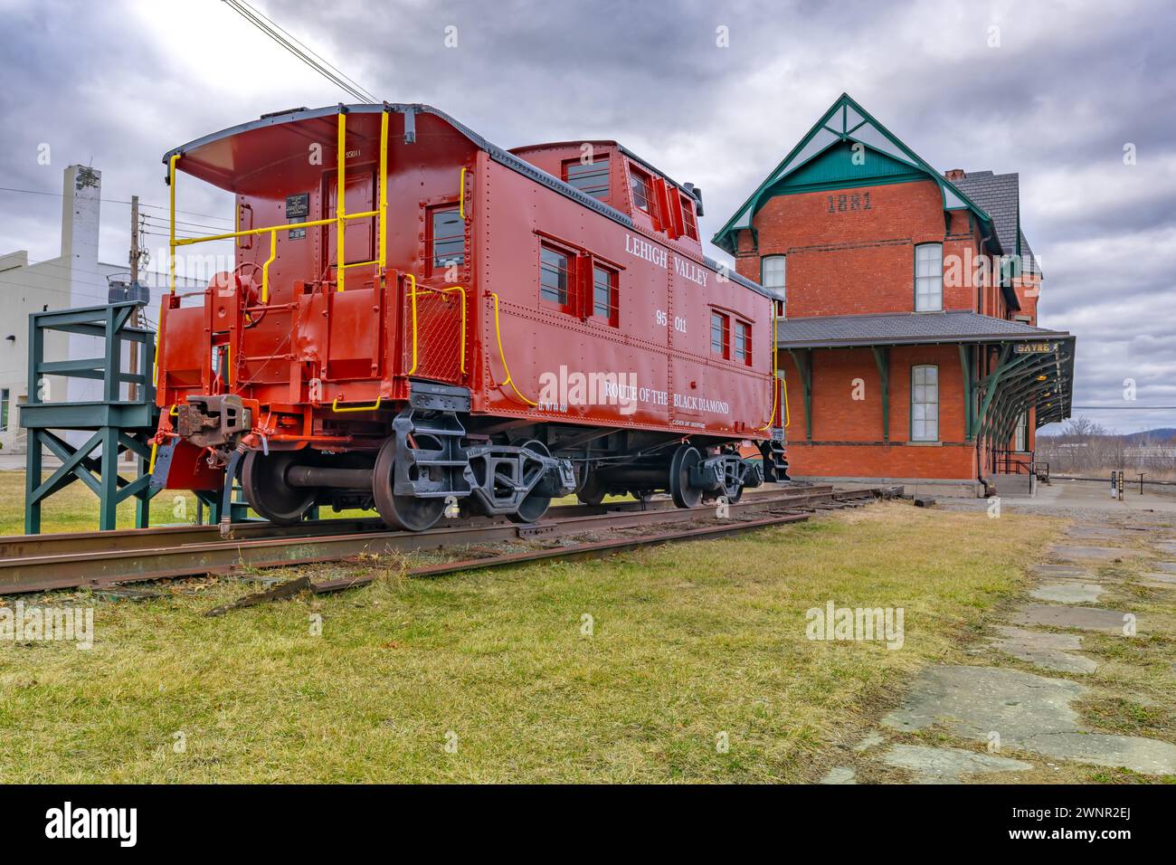 Sayre, PA, USA - 03-03-2024 - Restored red vintage caboose at the Sayre Historical Society Museum at Lehigh Valley Railroad Passenger Station. Stock Photo