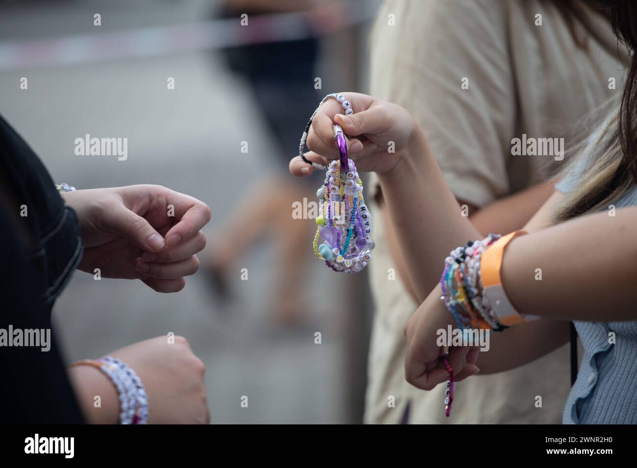 2 March 2024. At The Eras Tour concernt venue. Fans are exchanging Taylor Swift friendship bracelets among themselves. Singapore. Stock Photo