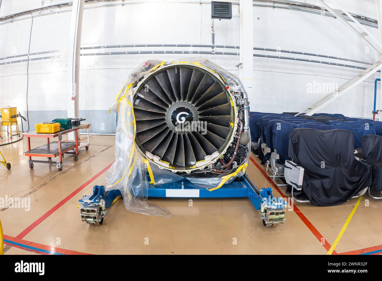 High-bypass turbofan aircraft engine in aviation hangar Stock Photo