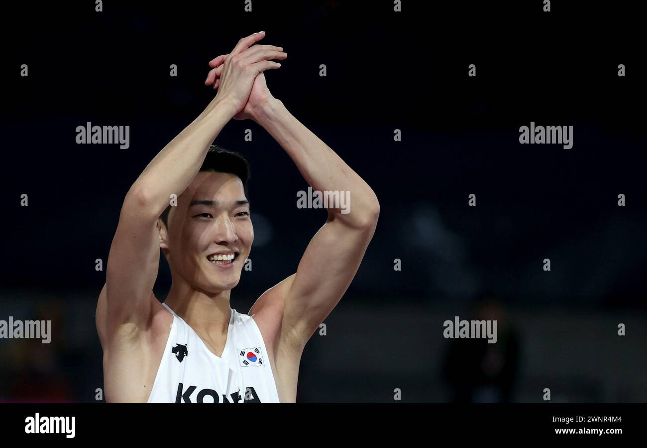 Glasgow, Britain. 3rd Mar, 2024. Woo Sanghyeok of South Korea celebrates in the Men's High Jump