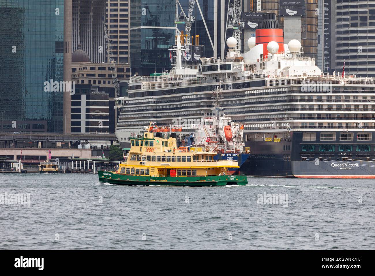 Sydney harbour, Cruise ship Queen Victoria, ferry MV Alexander and ICS Reliance fuel tanker in the harbour, Sydney,NSW,Australia,2024 Stock Photo